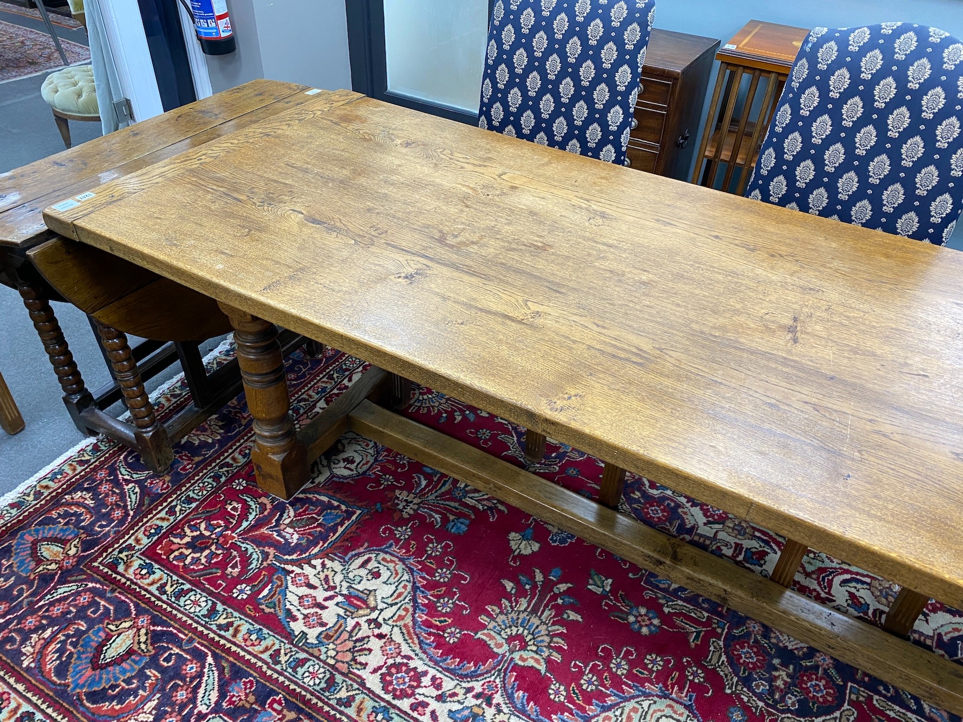 A large 18th century style rectangular oak refectory dining table, length 296cm, depth 89cm, height 76cm